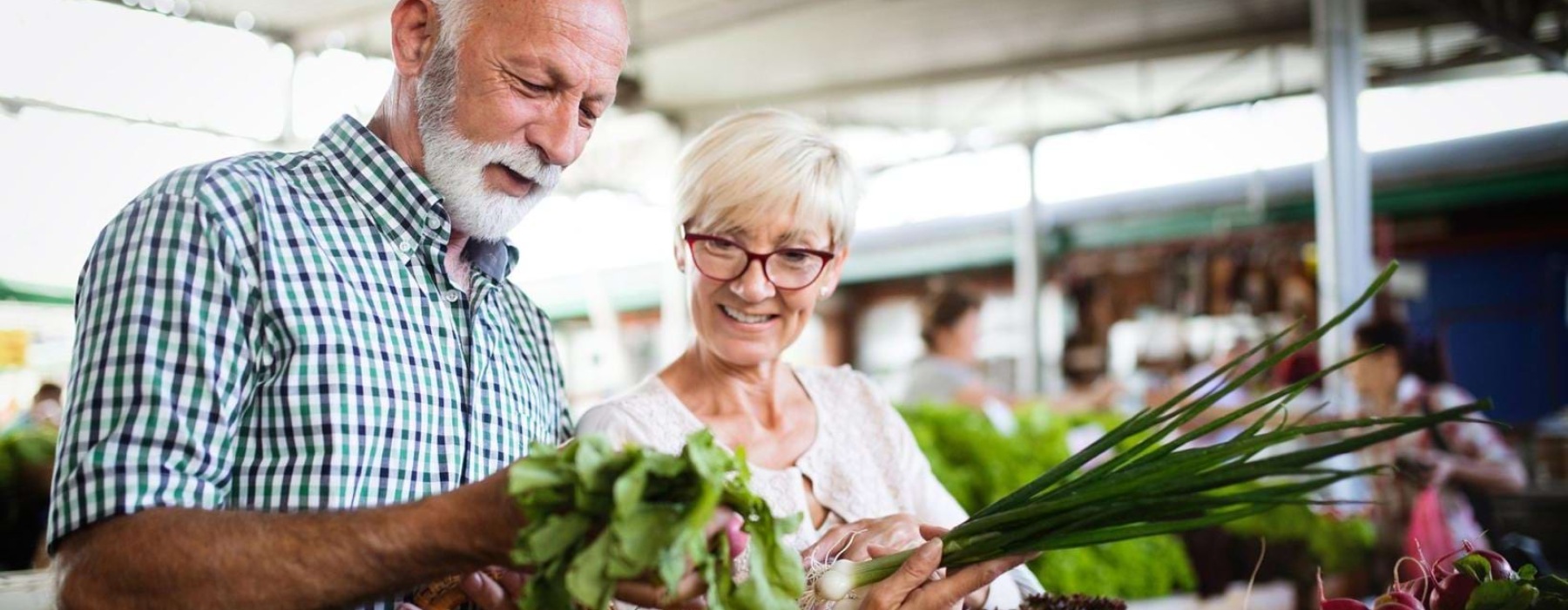 a man and a woman at a farmers market