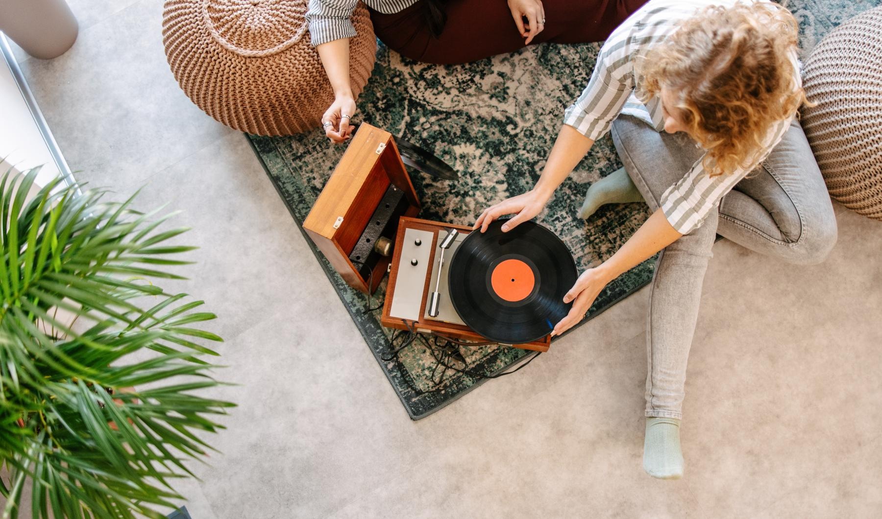 overhead shot of people playing a record