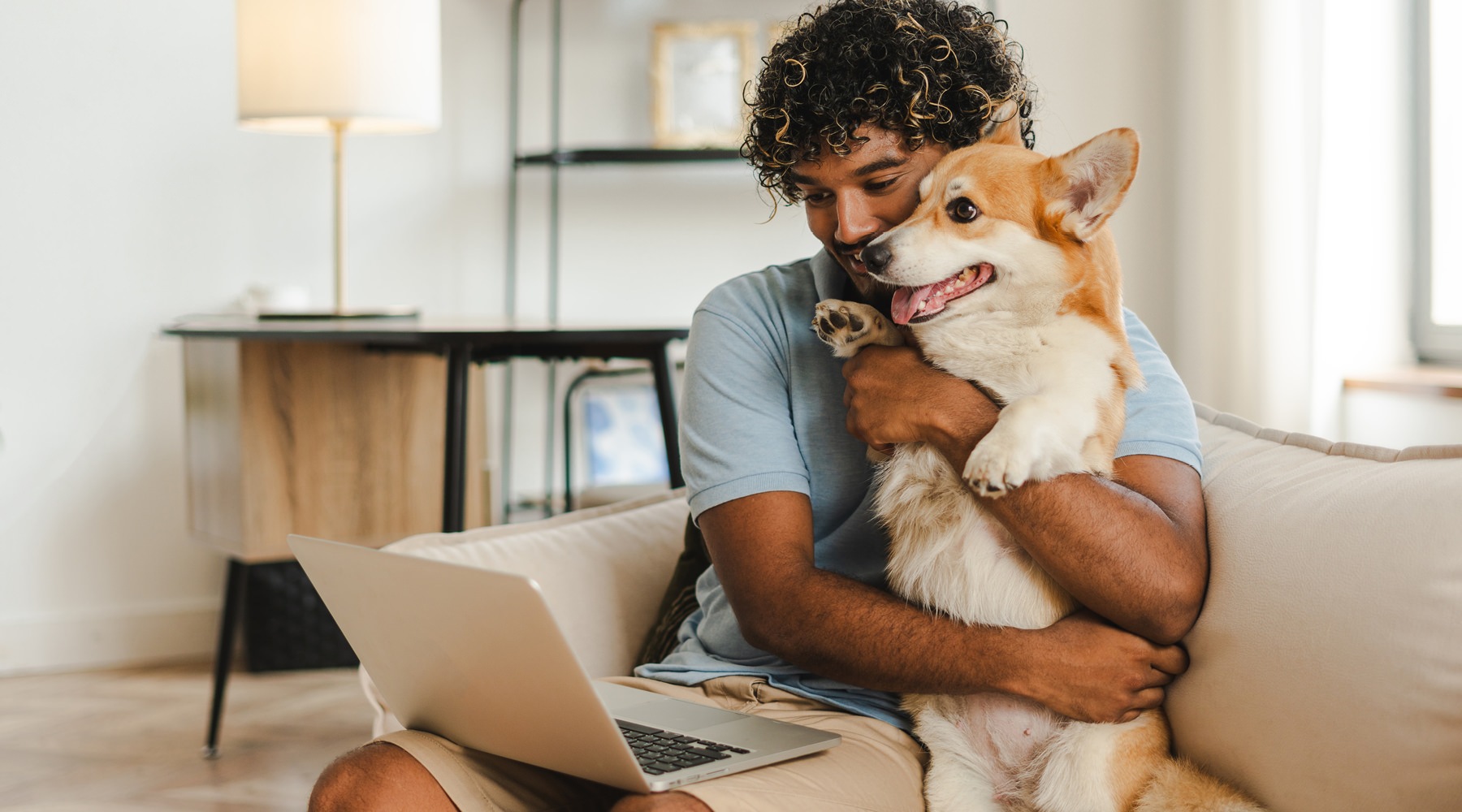 We are a pet friendly community a man holding his pet dog