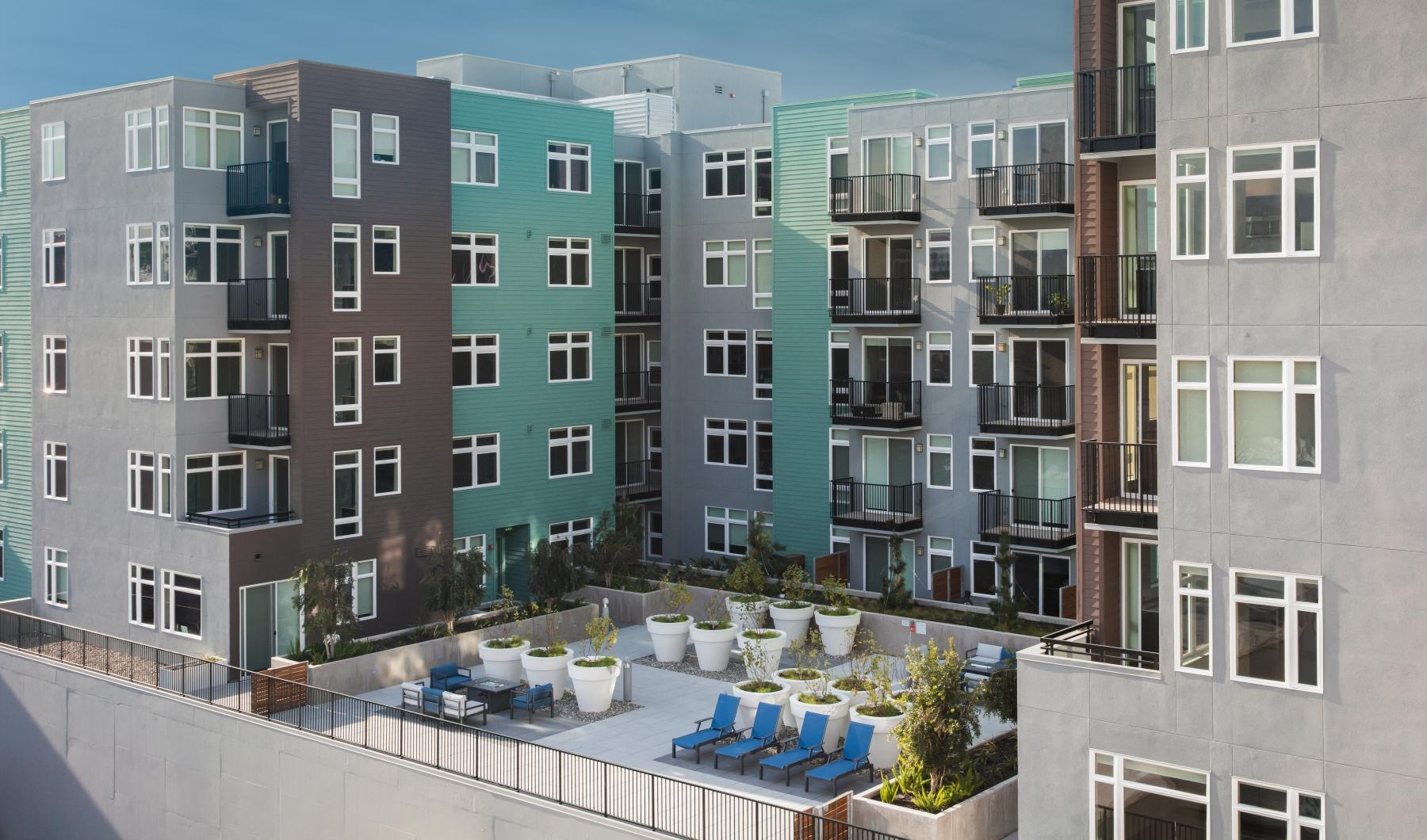 The essence of exceptional living lounge chairs and planters on rooftop terrace