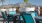 large potted plants, tables and chairs on terrace with mountain views