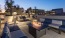 seating around fire pit on rooftop terrace