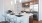 pendant lighting over kitchen serving counter with stools