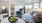 a living room with a large glass door to private balcony