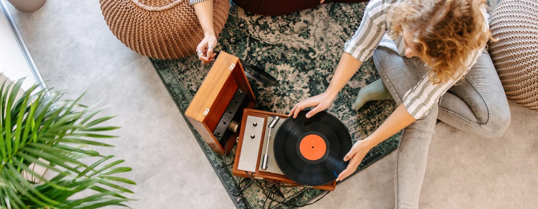 overhead shot of people playing a record